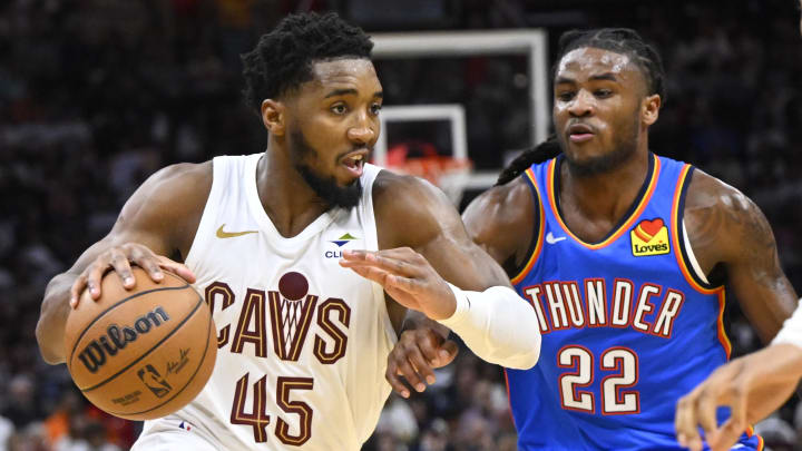 Oct 27, 2023; Cleveland, Ohio, USA; Cleveland Cavaliers guard Donovan Mitchell (45) moves against Oklahoma City Thunder guard Cason Wallace (22) in the third quarter at Rocket Mortgage FieldHouse. Mandatory Credit: David Richard-USA TODAY Sports