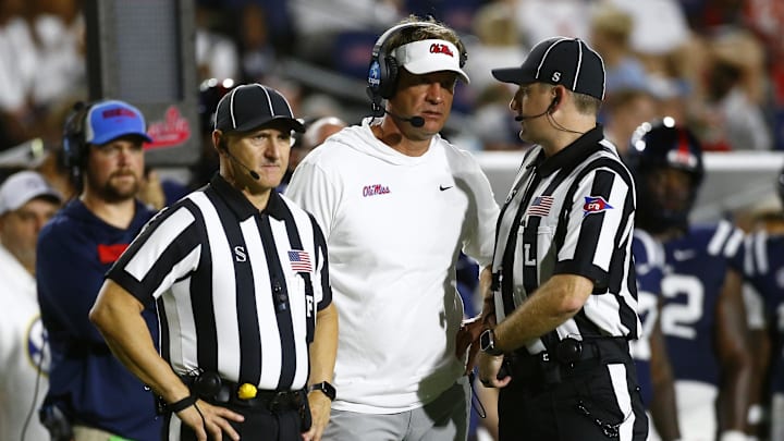 Aug 31, 2024; Oxford, Mississippi, USA; Mississippi Rebels head coach Lane Kiffin talks with officials after a penalty flag during the second half against the Furman Paladins at Vaught-Hemingway Stadium. Mandatory Credit: Petre Thomas-Imagn Images