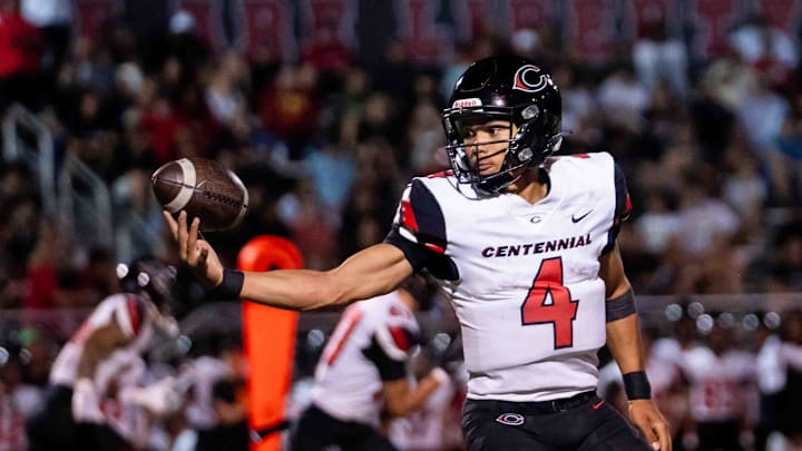 Centennial Huskies Quarterback Husan Longstreet (4) catches the ball at Liberty High School on Sept. 21, 2024, in Peoria.