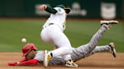 Angels pinch runner Andrew Velazquez (4) steals second base as Oakland Athletics shortstop Nick Allen (2) cannot handle the throw during the seventh inning at Oakland-Alameda County Coliseum on Sept. 2, 2023.