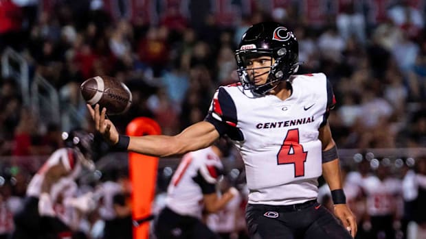Centennial Huskies Quarterback Husan Longstreet (4) catches the ball at Liberty High School on Sept. 21, 2024, in Peoria.