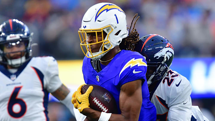 Dec 10, 2023; Inglewood, California, USA; Los Angeles Chargers wide receiver Quentin Johnston (1) runs the ball against Denver Broncos cornerback Fabian Moreau (23) during the second half at SoFi Stadium. Mandatory Credit: Gary A. Vasquez-Imagn Images Dec 10, 2023; Inglewood, California, USA; Los Angeles Chargers wide receiver Quentin Johnston (1) runs the ball against Denver Broncos cornerback Fabian Moreau (23) during the second half at SoFi Stadium. Mandatory Credit: Gary A. Vasquez-Imagn Images