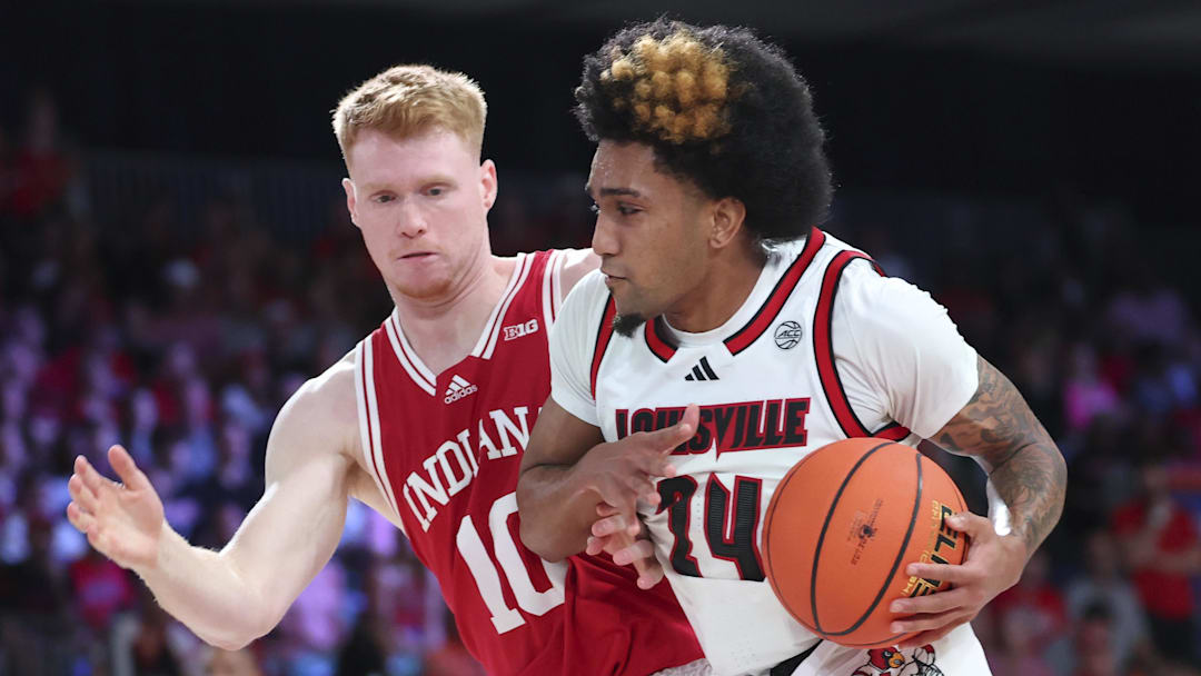 Louisville Cardinals guard Terrence Edwards Jr. (5) drives to the basket as Indiana Hoosiers forward Luke Goode (10) defends during the first half at the Atlantis Resort.