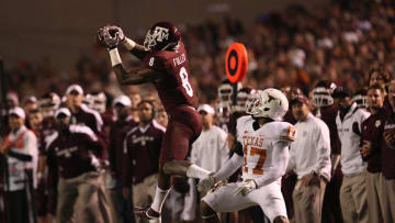 Nov 24, 2011; College Station, TX, USA; Texas A&M Aggies wide receiver Jeff Fuller (8) catches a pass over Texas Longhorns cornerback Adrian Phillips (17) during the second half at Kyle Field. Texas won 27-25. Mandatory Credit: Thomas Campbell-US Presswire