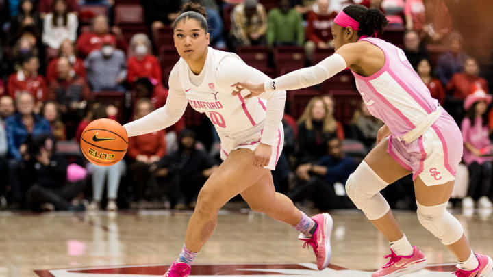 Feb 17, 2023; Stanford, California, USA;  Stanford Cardinal guard Talana Lepolo (10) drives past USC Trojans guard Kayla Williams (4) during the first half at Maples Pavilion. Mandatory Credit: John Hefti-USA TODAY Sports