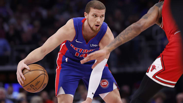 Apr 11, 2024; Detroit, Michigan, USA;  Detroit Pistons guard Malachi Flynn (14) dribbles in the first half against the Chicago Bulls at Little Caesars Arena. Mandatory Credit: Rick Osentoski-Imagn Images