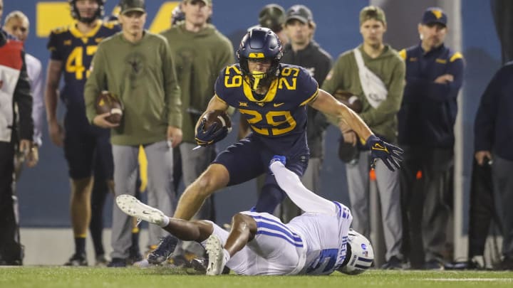 Nov 4, 2023; Morgantown, West Virginia, USA; West Virginia Mountaineers wide receiver Preston Fox (29) makes a catch and runs for extra yards during the first quarter against the Brigham Young Cougars at Mountaineer Field at Milan Puskar Stadium. 