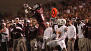 Nov 24, 2011; College Station, TX, USA; Texas A&M Aggies wide receiver Jeff Fuller (8) catches a pass over Texas Longhorns cornerback Adrian Phillips (17) during the second half at Kyle Field. Texas won 27-25. Mandatory Credit: Thomas Campbell-US Presswire