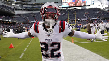 Nov 10, 2024; Chicago, Illinois, USA; New England Patriots cornerback Marco Wilson (22) celebrates the win against the Chicago Bears at Soldier Field. Mandatory Credit: David Banks-Imagn Images