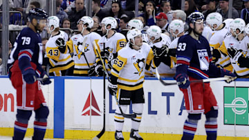 Feb 7, 2025; New York, New York, USA; Pittsburgh Penguins center Philip Tomasino (53) celebrates his goal against the New York Rangers with teammates during the second period at Madison Square Garden. Mandatory Credit: Brad Penner-Imagn Images
