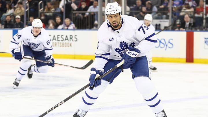 Feb 28, 2025; New York, New York, USA;  Toronto Maple Leafs right wing Ryan Reaves (75) controls the puck in the second period against the New York Rangers at Madison Square Garden. Mandatory Credit: Wendell Cruz-Imagn Images