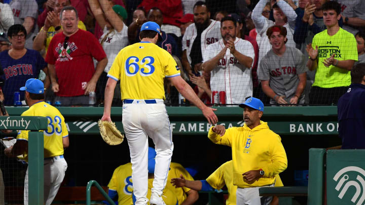 Jun 15, 2024; Boston, Massachusetts, USA;  Boston Red Sox relief pitcher Justin Slaten (63) is greeted by manager Alex Cora after pitching out of a jam during the fifth inning against the New York Yankees at Fenway Park. Mandatory Credit: Bob DeChiara-USA TODAY Sports