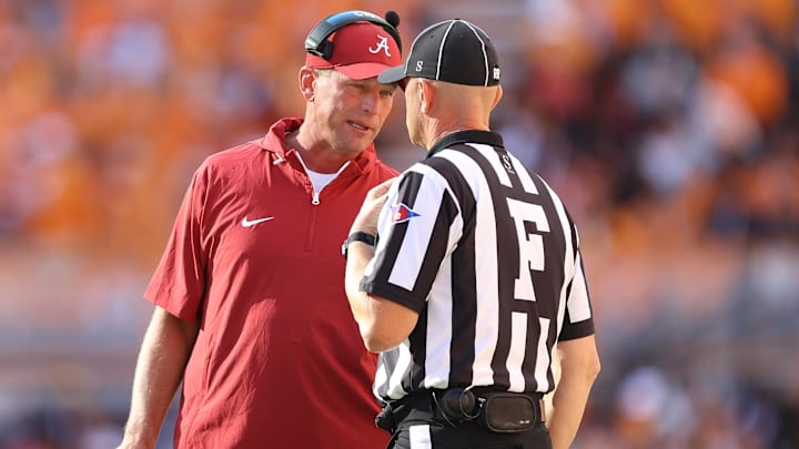 Oct 19, 2024; Knoxville, Tennessee, USA; Alabama Crimson Tide head coach Kalen DeBoer speaks with an official during the first quarter against the Tennessee Volunteers at Neyland Stadium. Mandatory Credit: Randy Sartin-Imagn Images
