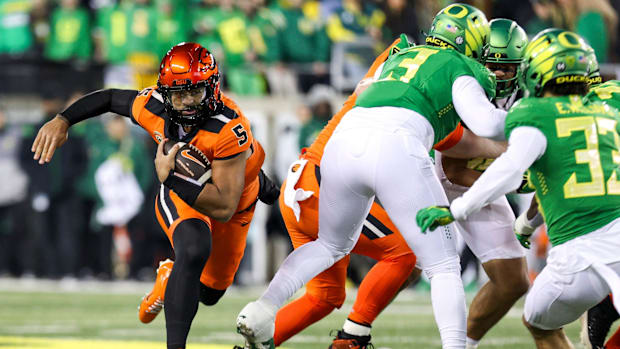 Oregon State Beavers quarterback DJ Uiagalelei holds on to the ball during the first half of the annual rivalry game against 