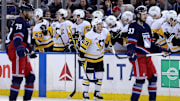 Feb 7, 2025; New York, New York, USA; Pittsburgh Penguins center Philip Tomasino (53) celebrates his goal against the New York Rangers with teammates during the second period at Madison Square Garden. Mandatory Credit: Brad Penner-Imagn Images