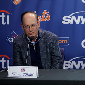 Dec 12, 2024; Flushing, NY, USA; New York Mets owner Steve Cohen speaks next to general manager David Stearns during a press conference to introduce right fielder Juan Soto at Citi Field. Mandatory Credit: Brad Penner-Imagn Images