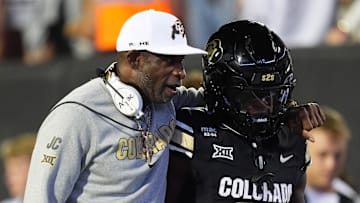 Sep 20, 2025; Boulder, Colorado, USA; Colorado Buffaloes head coach Deion Sanders and wide receiver Isaiah Hardge (17) during the first quarter against the Wyoming Cowboys at Folsom Field. Mandatory Credit: Ron Chenoy-Imagn Images