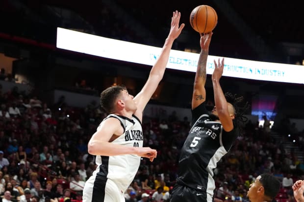 San Antonio Spurs guard Stephon Castle (5) shoots against Portland Trail Blazers center Donovan Clingan (23). 