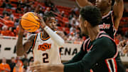 Dec 30, 2024; Stillwater, Oklahoma, USA; Oklahoma State Cowboys guard Arturo Dean (2) looks to pass during the first half against the Houston Cougars at Gallagher-Iba Arena. Mandatory Credit: William Purnell-Imagn Images