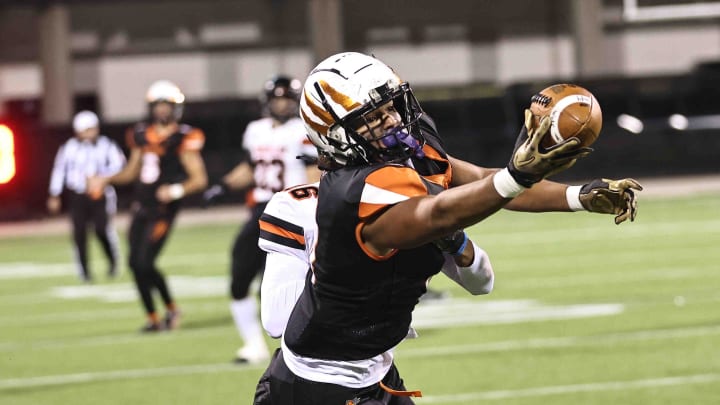 Anderson tight end Caden Piening (8) makes a one-handed catch during their state semifinal game against Massillon Washington at Historic Crew Stadium Friday, Nov. 24, 2023.