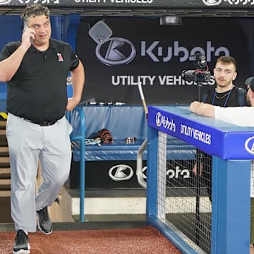 Angels general manager Perry Minasian walks out of the dugout during batting practice before a game against the Toronto Blue Jays at Rogers Centre on July 28, 2023.