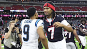 Aug 16, 2025; Houston, Texas, USA; Carolina Panthers quarterback Bryce Young (9) and Houston Texans quarterback C.J. Stroud (7) greet on the field after the game at NRG Stadium. Mandatory Credit: Troy Taormina-Imagn Images