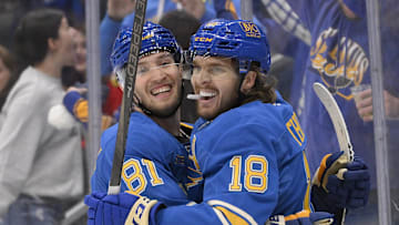 Mar 22, 2025; St. Louis, Missouri, USA;  St. Louis Blues center Robert Thomas (18) celebrates with center Dylan Holloway (81) after scoring against the Chicago Blackhawks during the second period at Enterprise Center. Mandatory Credit: Jeff Curry-Imagn Images