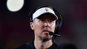 Nov 7, 2025; Los Angeles, California, USA; Southern California Trojans head coach Lincoln Riley watches game action against the Northwestern Wildcats during the second half at the Los Angeles Memorial Coliseum. Mandatory Credit: Gary A. Vasquez-Imagn Images