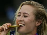 Aug 7, 2021; Tokyo, Japan; Nelly Korda (USA) celebrates with her gold medal on the podium after the final round of the women's individual stroke play of the Tokyo 2020 Olympic Summer Games at Kasumigaseki Country Club. Mandatory Credit: Michael Madrid-USA TODAY Sports