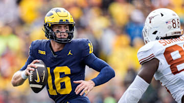 Michigan quarterback Davis Warren (16) looks to makes a pass against Texas linebacker Barryn Sorrell (88) during the second half at Michigan Stadium in Ann Arbor on Saturday, September 7, 2024.