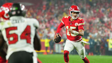 Nov 4, 2024; Kansas City, Missouri, USA; Kansas City Chiefs quarterback Patrick Mahomes (15) rolls out to pass during the second half against the Tampa Bay Buccaneers at GEHA Field at Arrowhead Stadium. 