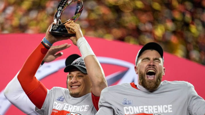 Jan. 29, 2023: Patrick Mahomes raises the Lamar Hunt Trophy while Travis Kelce celebrates after the Kansas City Chiefs' 23-20 win over the Cincinnati Bengals in the AFC championship game at Arrowhead Stadium.