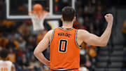 Dec 6, 2025; Nashville, Tennessee, USA;  Illinois Fighting Illini forward David Mirkovic (0) celebrates a three-point shot by guard Keaton Wagler (23) against the Tennessee Volunteers during the first half at Bridgestone Arena. Mandatory Credit: Steve Roberts-Imagn Images