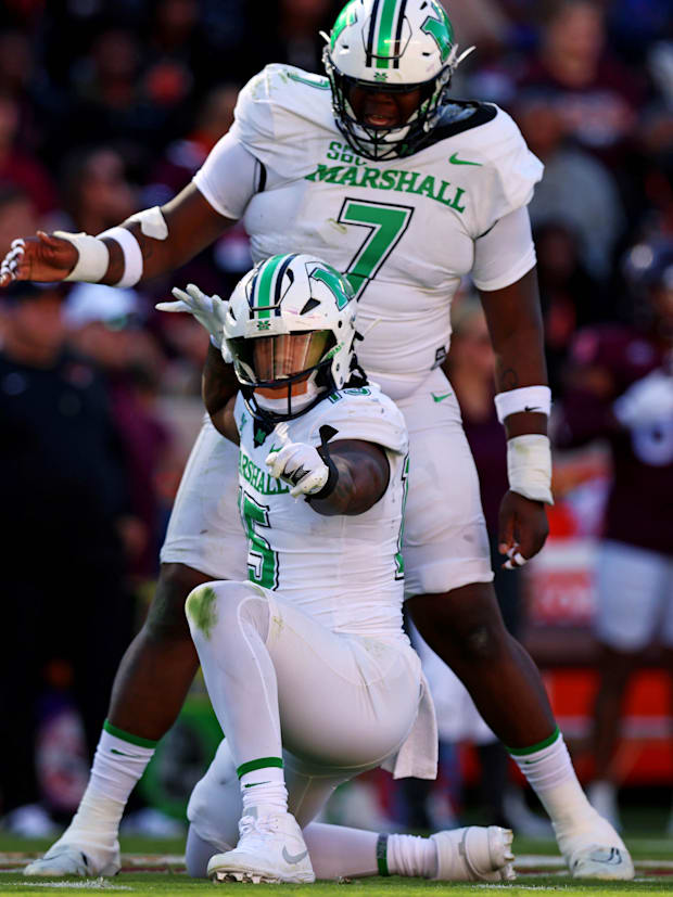 Marshall Thundering Herd defensive lineman Mike Green (15) celebrates after sacking Virginia Tech Hokies quarterback.