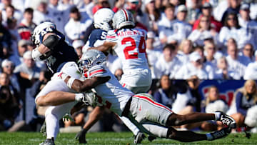Ohio State Buckeyes safety Caleb Downs (2) tackles Penn State Nittany Lions tight end Tyler Warren (44) during the second half of the NCAA football game at Beaver Stadium in University Park, Pa. on Saturday, Nov. 2, 2024. Ohio State won 20-13.