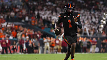 Oct 26, 2024; Miami Gardens, Florida, USA; Miami Hurricanes quarterback Cam Ward (1) runs with the football against the Florida State Seminoles during the second quarter at Hard Rock Stadium. Mandatory Credit: Sam Navarro-Imagn Images