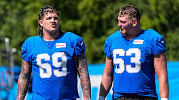 Detroit Lions guard Tate Ratledge (69), left, and offensive tackle Mason Miller (63) 