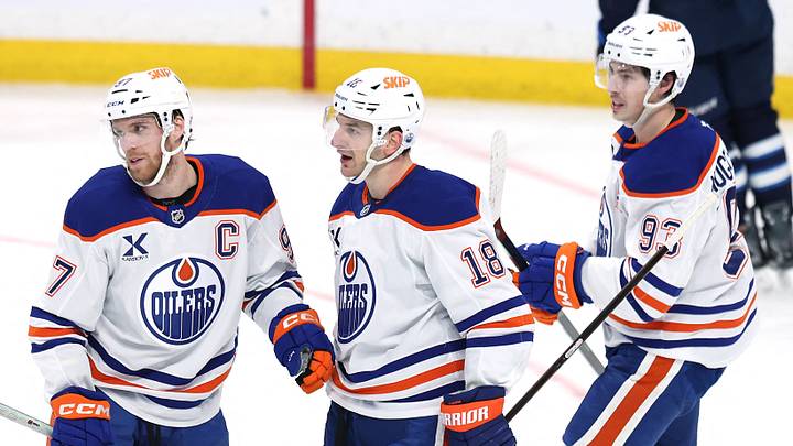 Dec 29, 2025; Winnipeg, Manitoba, CAN; Edmonton Oilers left wing Zach Hyman (18) celebrates an empty net goal against the Winnipeg Jets with Connor McDavid (97) and Ryan Nugent-Hopkins (93) in the third period at Canada Life Centre. Mandatory Credit: James Carey Lauder-Imagn Images