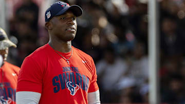 Houston Texans head coach DeMeco Ryans watches players warm up during training camp practice at the Houston Methodist Training Center.