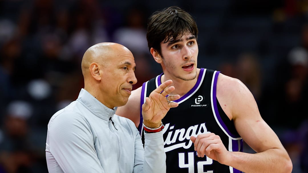 Dec 11, 2025; Sacramento, California, USA; Sacramento Kings head coach Doug Christie talks with center Maxime Raynaud (42) during the fourth quarter against the Denver Nuggets at Golden 1 Center.
