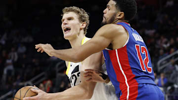 Dec 19, 2024; Detroit, Michigan, USA;  Utah Jazz forward Lauri Markkanen (23) is fouled by Detroit Pistons forward Tobias Harris (12) in the fourth quarter at Little Caesars Arena.