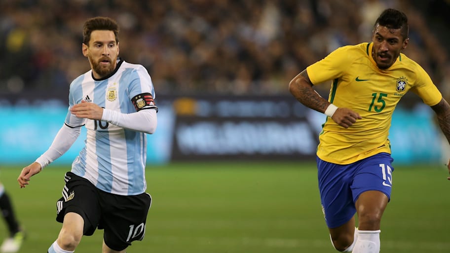Lionel Messi and Paulinho