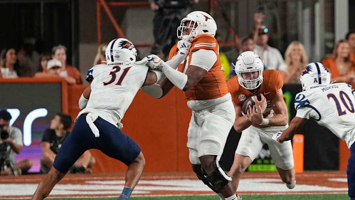 Sep 14, 2024; Austin, Texas, USA; Texas Longhorns offensive lineman Andre Cojoe (77) blocks for running back Colin Page (27) during the second half against the Texas-San Antonio Roadrunners at Darrell K Royal-Texas Memorial Stadium. Mandatory Credit: Scott Wachter-Imagn Images
