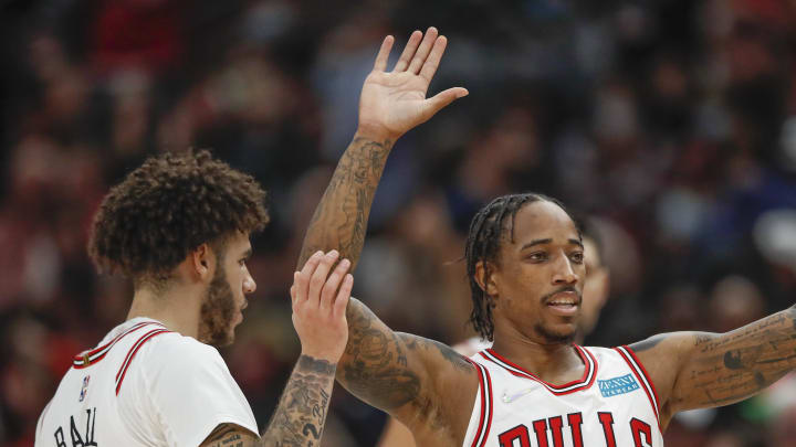 Nov 8, 2021; Chicago, Illinois, USA; Chicago Bulls forward DeMar DeRozan (11) celebrates with guard Lonzo Ball (2) after scoring against the Brooklyn Nets during the second half at United Center. Mandatory Credit: Kamil Krzaczynski-USA TODAY Sports