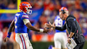 Florida Gators quarterback DJ Lagway (2) is congratulated by Florida Gators head coach Billy Napier after a series during the first half at Ben Hill Griffin Stadium in Gainesville, FL on Saturday, October 19, 2024 against the Kentucky Wildcats. [Doug Engle/Gainesville Sun]
