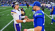 Nov 30, 2025; Seattle, Washington, USA; Minnesota Vikings quarterback Max Brosmer (12) and Seattle Seahawks quarterback Sam Darnold (14) react after the game at Lumen Field.