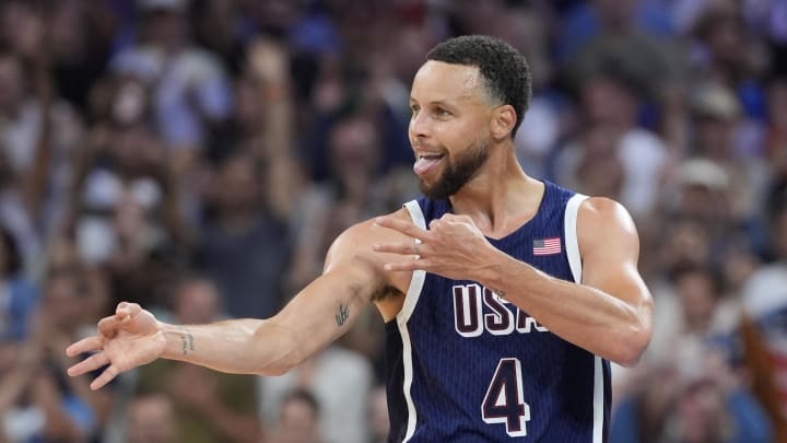 Jul 28, 2024; Villeneuve-d'Ascq, France; United States shooting guard Stephen Curry (4) reacts after a basket in the fourth quarter against Serbia during the Paris 2024 Olympic Summer Games at Stade Pierre-Mauroy. Mandatory Credit: John David Mercer-USA TODAY Sports