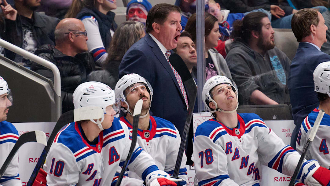 Mar 29, 2025; San Jose, California, USA; New York Rangers head coach Peter Laviolette instructs his team as left wings Artemi Panarin (10), Chris Kreider (20) and Brennan Othmann (78) look on against the San Jose Sharks during the third period at SAP Center at San Jose. Mandatory Credit: Robert Edwards-Imagn Images