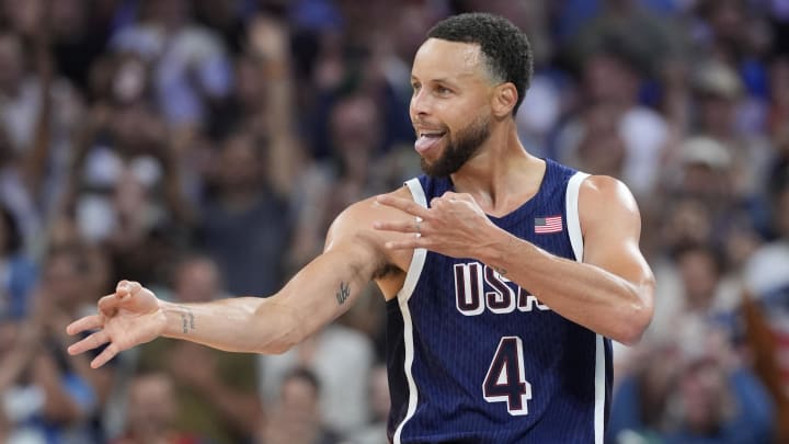 Jul 28, 2024; Villeneuve-d'Ascq, France; United States shooting guard Stephen Curry (4) reacts after hitting a shot in the fourth quarter against Serbia during the Paris 2024 Olympic Summer Games at Stade Pierre-Mauroy. John David Mercer-USA TODAY Sports