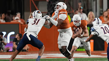 Sep 14, 2024; Austin, Texas, USA; Texas Longhorns offensive lineman Andre Cojoe (77) blocks for running back Colin Page (27) during the second half against the Texas-San Antonio Roadrunners at Darrell K Royal-Texas Memorial Stadium. Mandatory Credit: Scott Wachter-Imagn Images